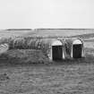 View from NW showing torpedo store huts.