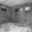 Interior view of bomb store shed showing location of 'safe working' notice.