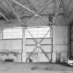 Interior view of southwestern C1 type hangar showing steel roof framing and additional steel support for door area.