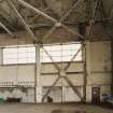 Interior view of southwestern C1 type hangar showing steel roof framing and additional steel support for door area.