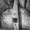 Building D, east general view of 'room' showing canopied chimney, scarcement, 
small press and turf walling above