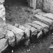 Building A, detail of stone-on-edge step to doorways of byre and stable