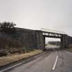 General view of railway bridge from NW, showing granite abutments and single steel truss