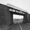 View of railway bridge from NW, showing granite abutments and single steel truss