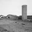 Grain silo, farmhouse and cattle courts, view from south west