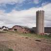 Grain silo, farmhouse and cattle courts, view from south west