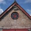 Cattle court, detail of circular window in south gable