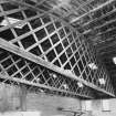 Interior. Cattle shed, view showing roof trusses