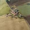 Oblique aerial view centred on the farmsteading, taken from the ENE.