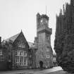 View of North West entrance tower and old school from North East