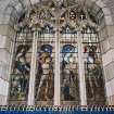 Interior. E stained glass window by J Ninian Comper 1928 of the four archangels and Canon Mackintosh the donor.