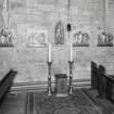 Interior. The Shrine of St Michael The Archangel flanked by stations of the cross on the S wall