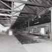 Interior general view from south west, showing 2 bays of king-post trusses 2 tracks, 
and central row of round cast-iron columns (0.26m diameter, and at approximately 
11.0m centres)