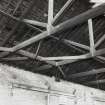 View of area of specially braced roof trusses, with "u"-shaped stabilising wooden 
bracket at wallhead