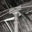 Detail of typical cast-iron column head and wooden beam, with iron ties