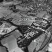 RAF WWII oblique aerial photograph of Inverness, Cameron Barracks and part of Raigmore camp.  Within the barracks are several slit practice trenches.