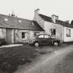 View from south south east of farmhouse and converted byre