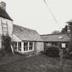 View of converted byre and byre from north west