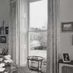 Interior. Ground floor, drawing room, view looking through E window showing river beyond