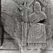 Fragment of West Highland carved slab (Arisaig 1) showing ecclesiastic figure. (Flash)