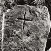 Stone slab with incised cross.