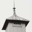 Detail of finial on top of sheet- metal-clad elevator tower above  Mill Room.