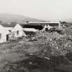 General view from SE of distillery warehouses during demolition