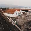 General view from SSE of distillery warehouses during demolition