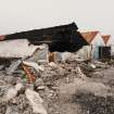 Detailed view from SE of warehouse during demolition, revealing mass- concrete structure.