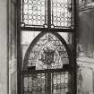 Ground floor staircase half-landing, view of stained glass window