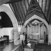 Interior. General view of organ and stone arches.