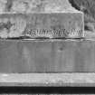 Detail of sculptors name (J. Marshall)