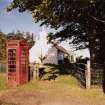 View of telephone box and adjoining cottage