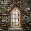 Detail of leaded glass window in E wall of church