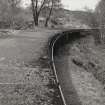 Curve in conduit after Lower Penstock.  The addition of power cables (on side of conduit) permitted automated monitoring and control of water flow, and the motorising of valves.