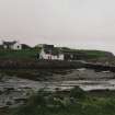 Muck, Port Mor, Pier Cottage. Cottage, gear store and quay. View from NW.