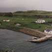 Muck, Port Mor and Pier Cottage. School, quay, cottage and gear store. View from WSW.