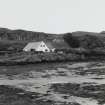 Muck, Port Mor. Port Mor House Hotel and building (NM 4208 7938) on terrace above. View from SE.