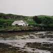 Muck, Port Mor. Port Mor House Hotel and building (NM 4208 7938) on terrace above. View from SE.