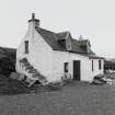 Muck, Port Mor, Pier Cottage. Cottage and gear store. View from NNW.