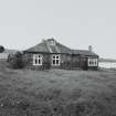 Muck, Gallanach, New House. Bungalow. View of front elevation from E.