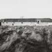 View from South South West of South range with Threshing Barn on right and Granary above pens, stalls and cart shed