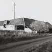 View from South East of corner of Threshing Barn with covered water wheel