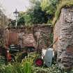 View of 'Jenny's Cottage' from N showing fireplace