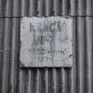 Evanton Airfield technical area, plate on rear of Admiralty 'S' type aircraft sheds with notice saying 'Hangar No.7 S.N.S.O Rosyth Key H'