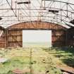 Fearn Airfield, W perimeter area, Mainhill type hangar showing interior and steel roof framing, view from SW.