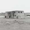 Fearn Airfield, SE technical area.  Brick and concrete technical building, view from SW showing rear elevation.