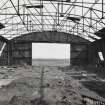 Fearn Airfield, W perimiter area, Mainhill type hangar showing interior and roof steel framing view from SW.