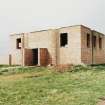 Fearn Airfield, SE technical area.  Brick and concrete built technical building, view from S showing vehicle entrance.