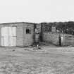Fearn Airfield, Loans of Tullich accommodation camp.  View from NE of motor transport repair building and garage.  A small blast wall is visible on N wall of garage outshot.